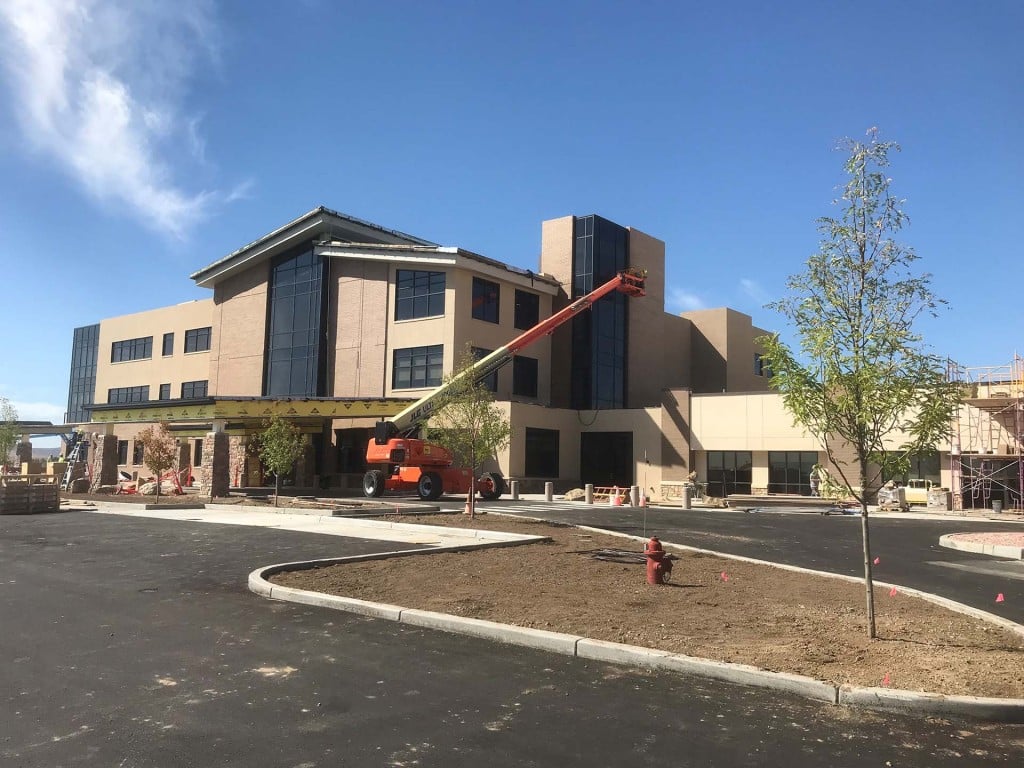Medical clinic under construction with boom lift
