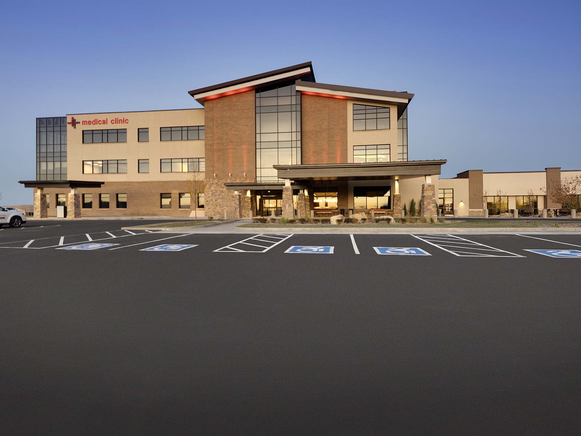 Worms eye view of exterior medical clinic from parking lot