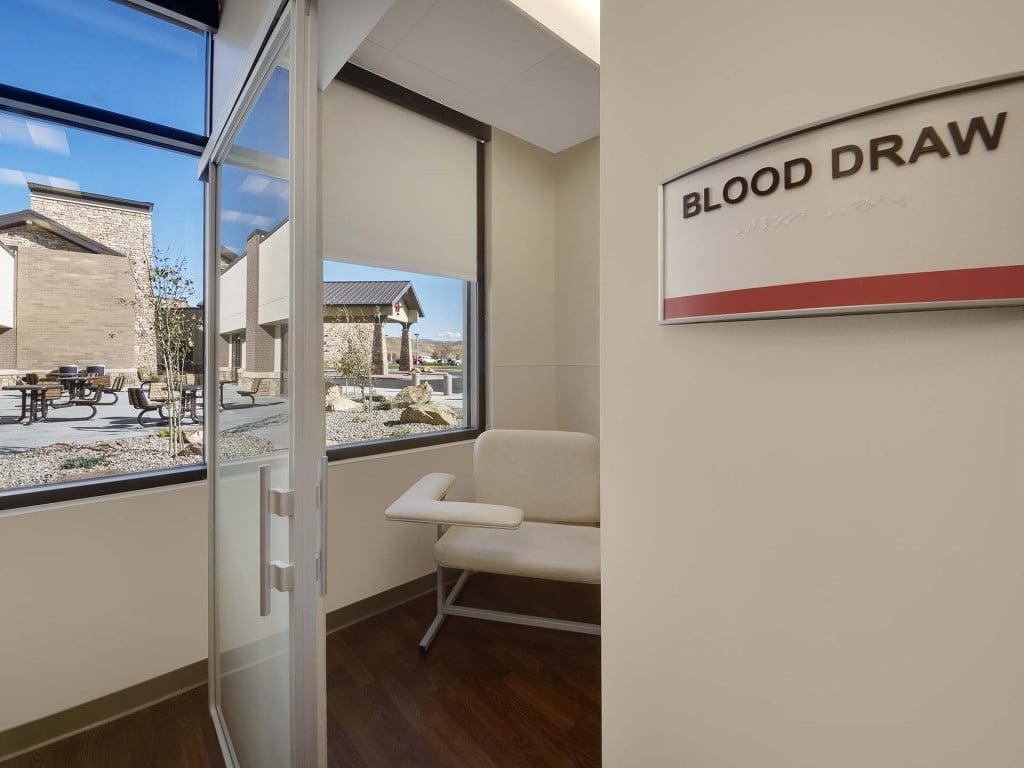 Blood draw chair and sign