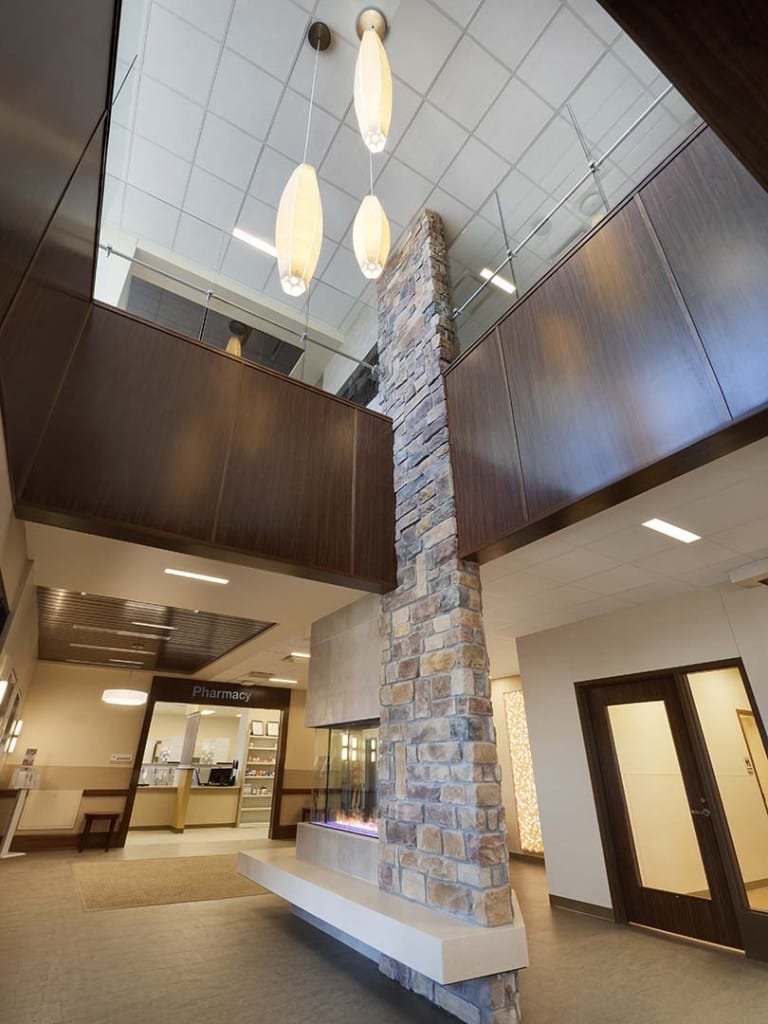 Worms eye view of interior building with balconies and chandeliers
