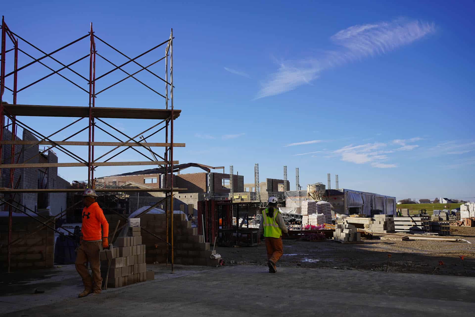 People walking around construction site
