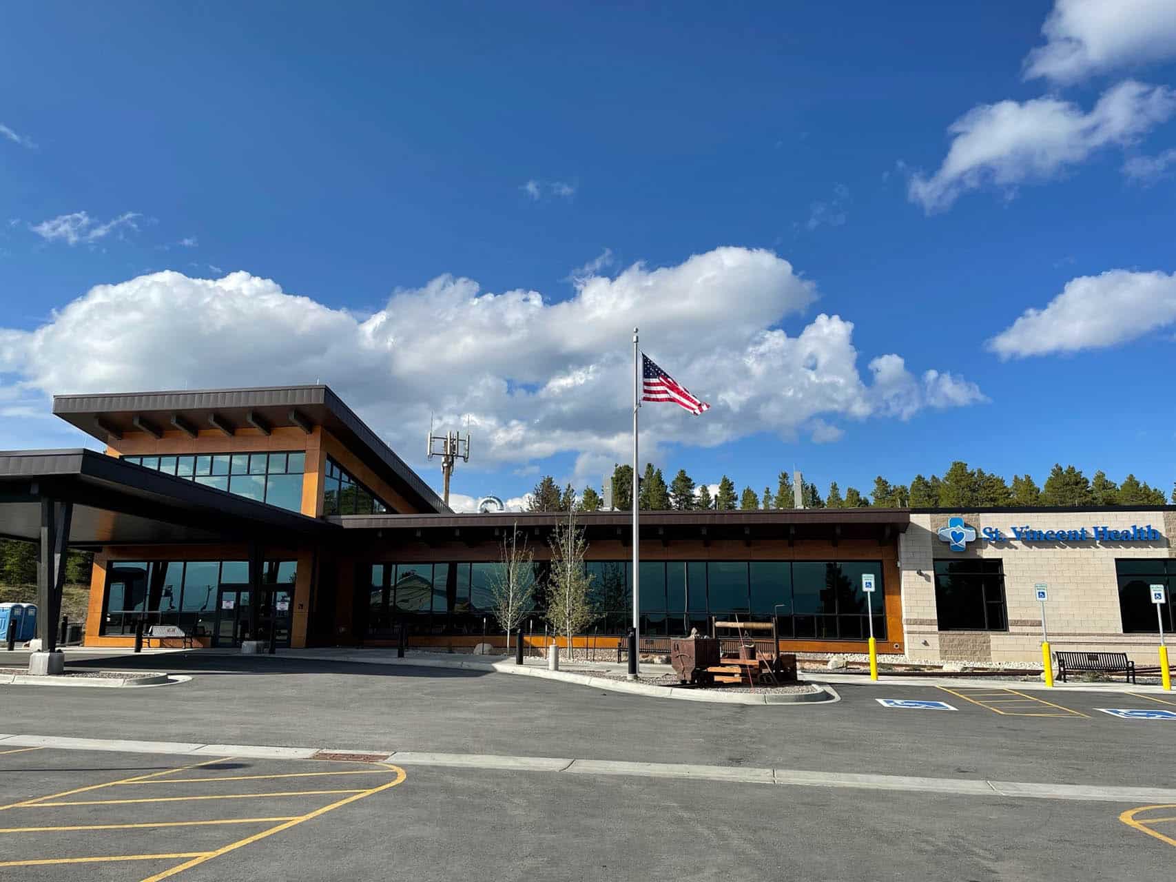 US flag flying over medical clinic building